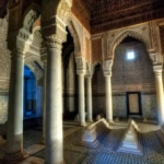 Ornate interior of the Saadian Tombs in dramatic light